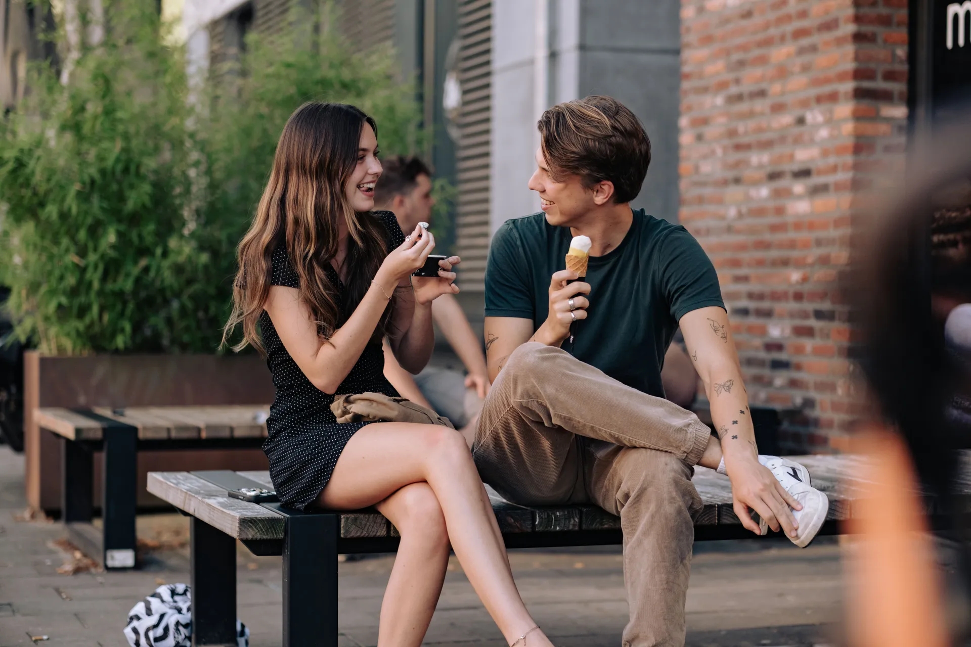 A couple enjoying an ice cream at the Breda Ice Cream Parlor.
