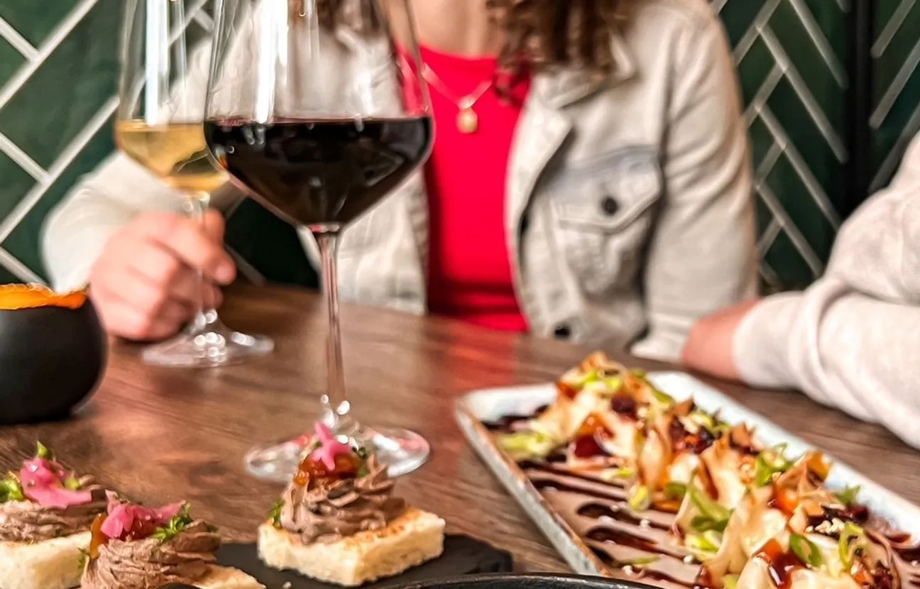 Table with dishes and glasses of wine
