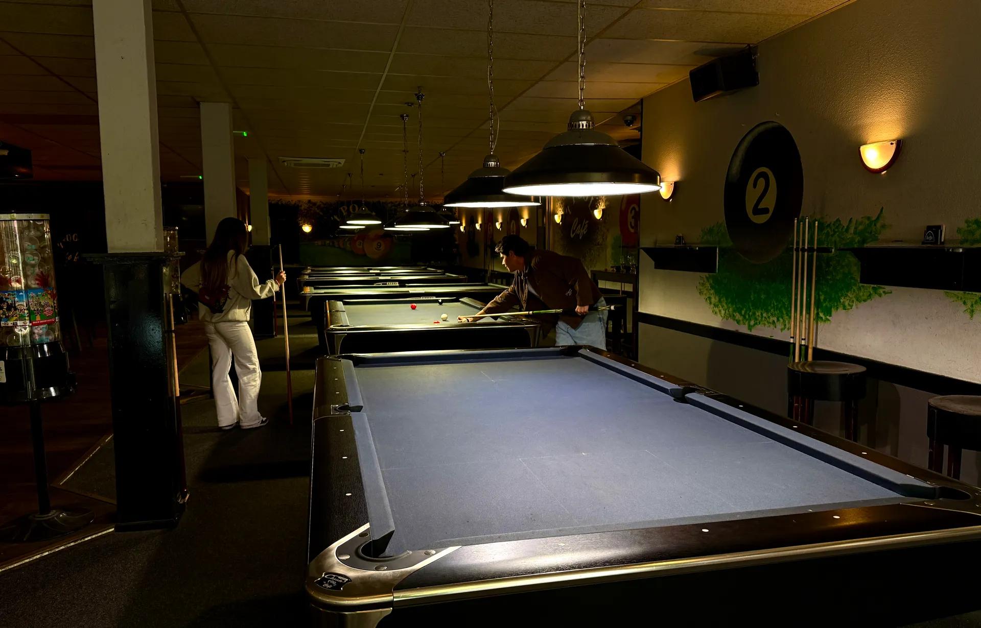 A room with different pool tables